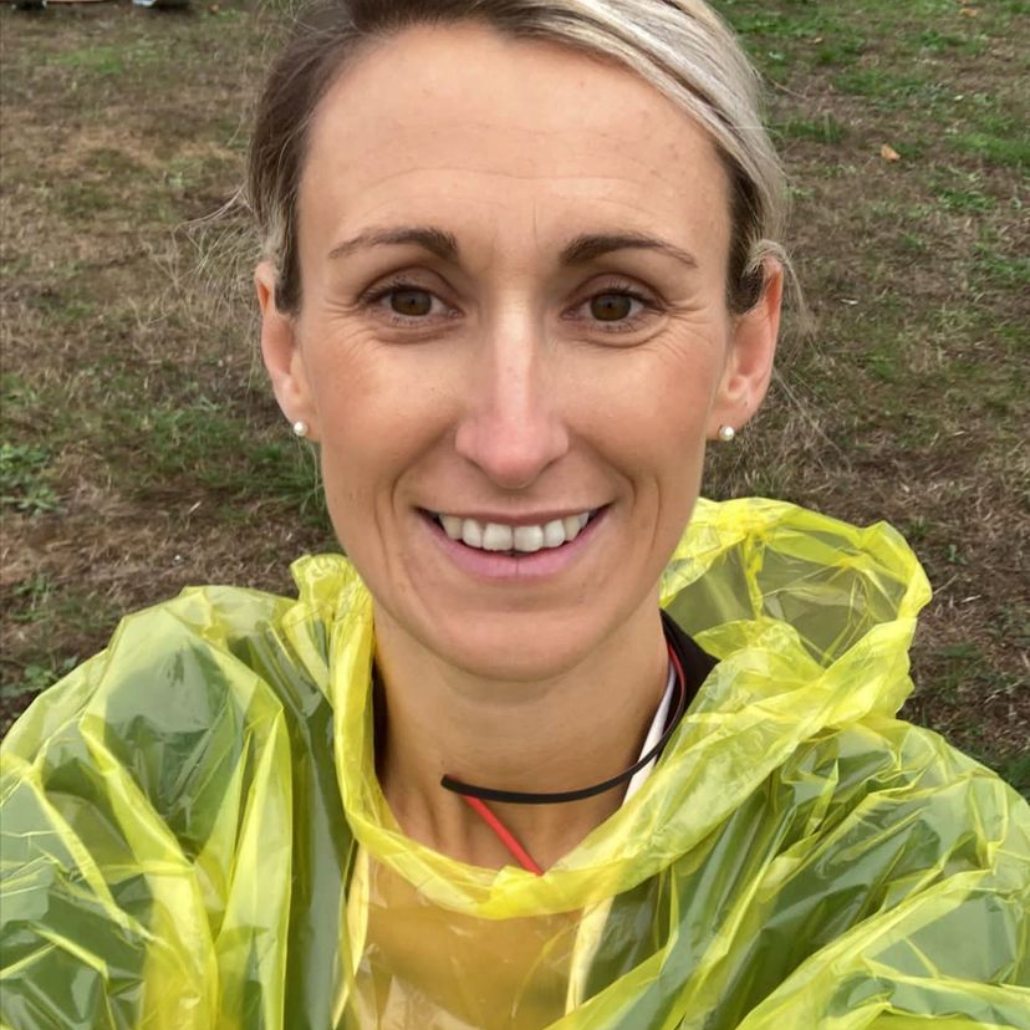 image shows ashley smiling to camera wearing her running gear